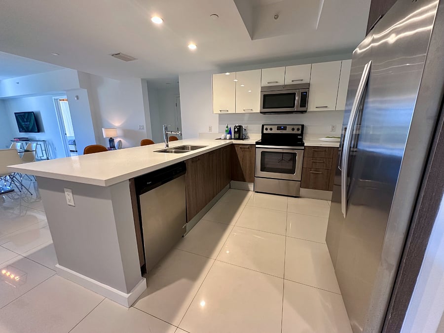 Enjoy the convenience of a full-size kitchen featuring a refrigerator, stove, oven, microwave, washer, and dryerperfect for extended stays and all the comforts of home.