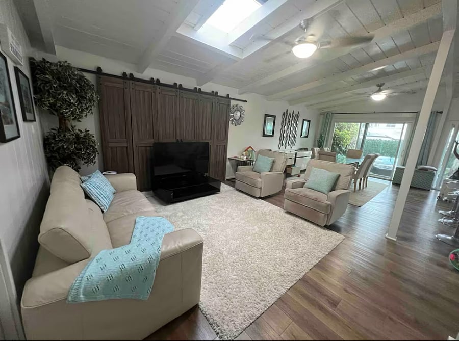 UNIT A - 2 BEDROOM

Living room has a couch, 2 recliner/glider chairs. Open concept design. 
