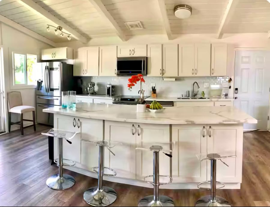 UNIT A - 2 BEDROOM

Full size kitchen with microwave, stove, oven, dishwasher, fridge, coffee maker and a large island. Basic pots and pans and cooking utensils provided. Also has plates and basic utensils. 
