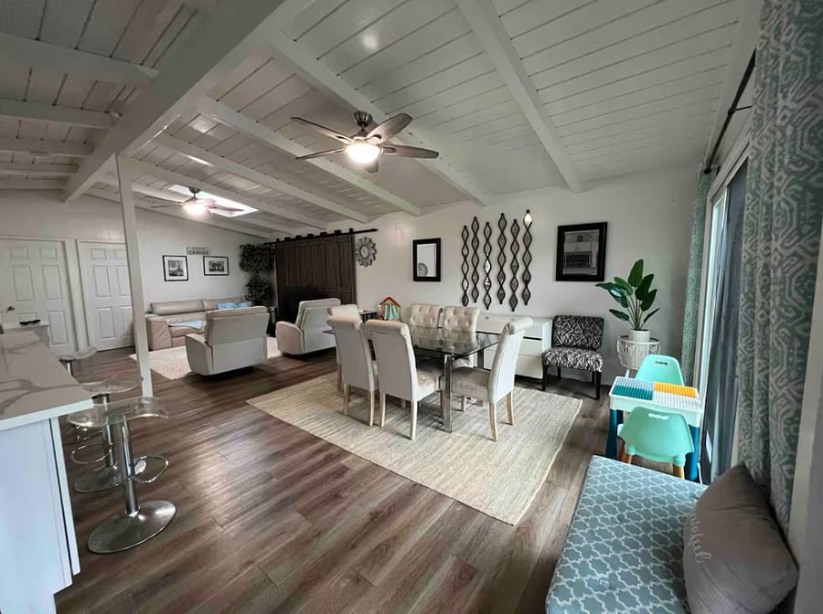 UNIT A - 2 BEDROOM

Dining room has a large dining table with 6 chairs. Open concept design. Kitchen has a large island with 4 bar stools. 