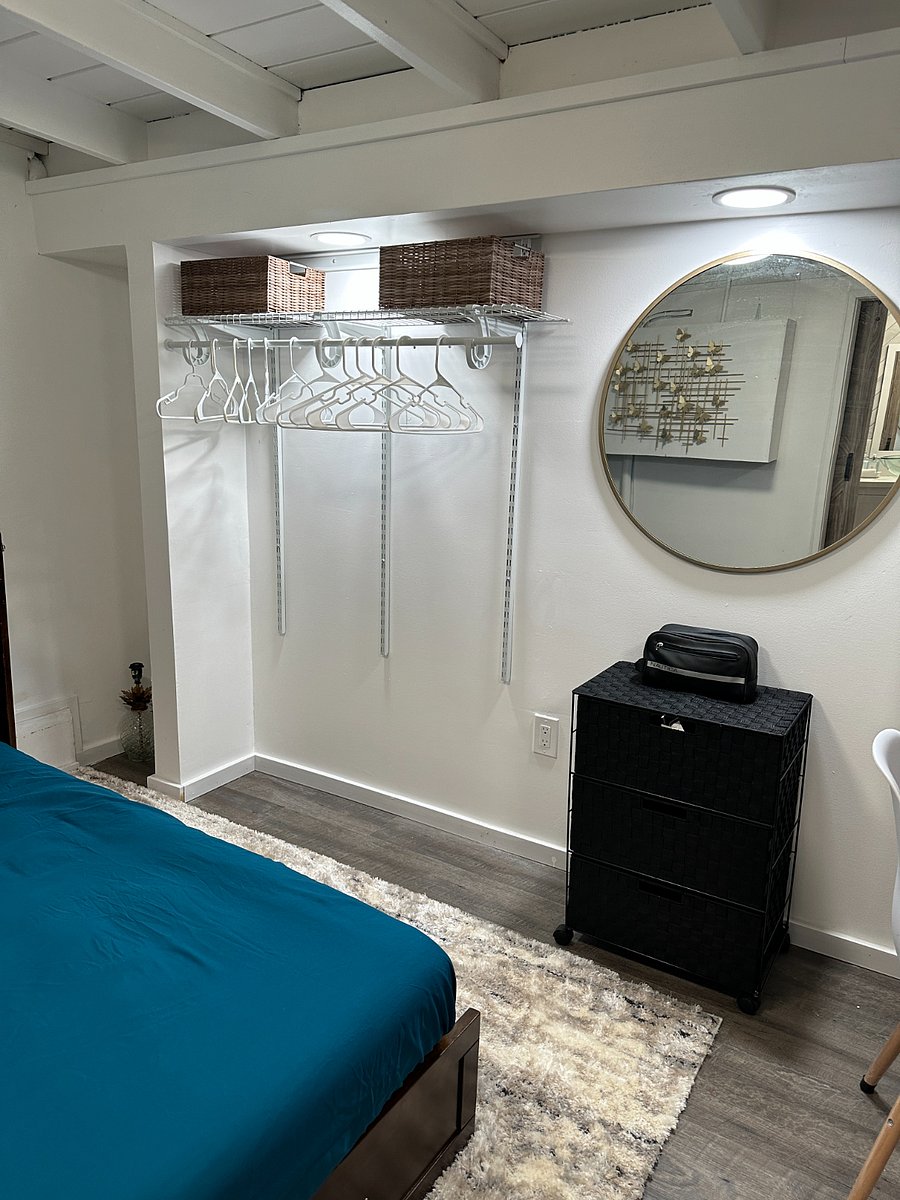 STUDIO (UNIT C)

Open closet and drawer with round mirror.