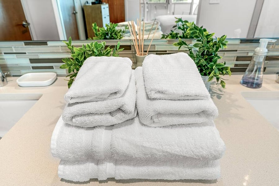 A spa-like ambiance! A stylish 2 bathroom vanity with clean towels.