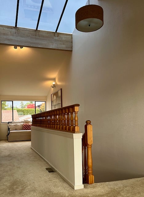 Room and light filled second floor hallway