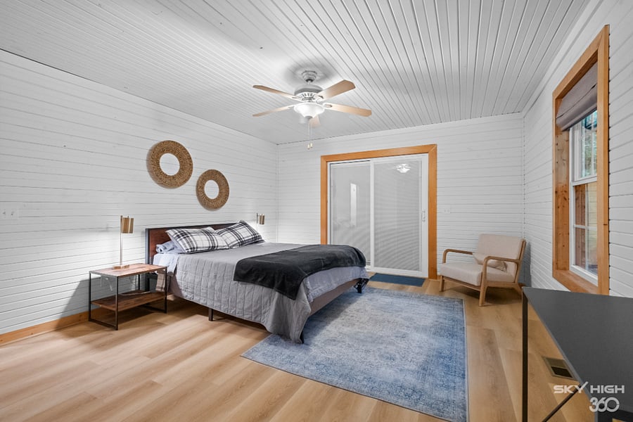 Master bedroom with sliding glass door to back deck