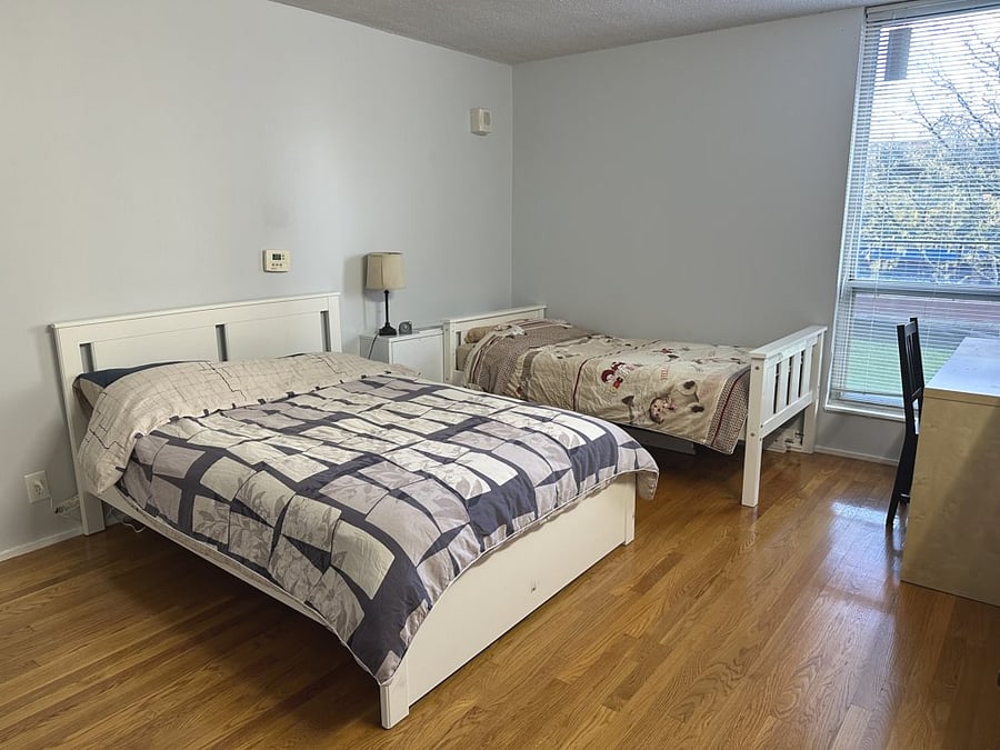 Bedroom 2 with one full bed and one twin bed