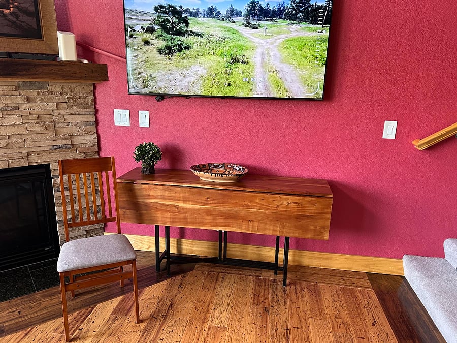 Folding dining table that seats 6. The chairs for this table are in the closet under the stairs.