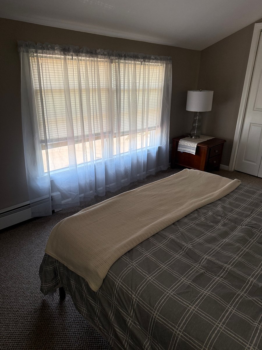 Large windows with lots of light with window treatments