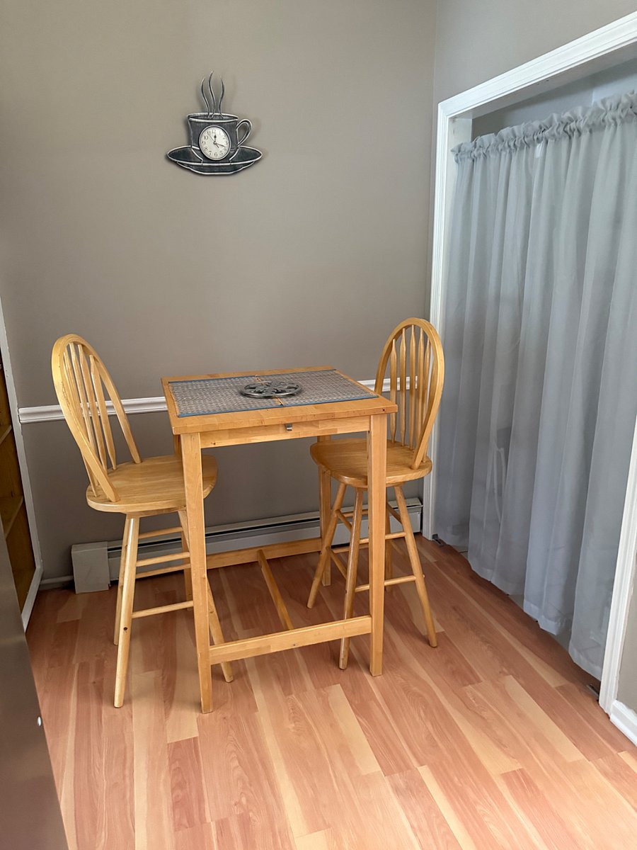 High top seating with laundry ata and tall cabinet for storage