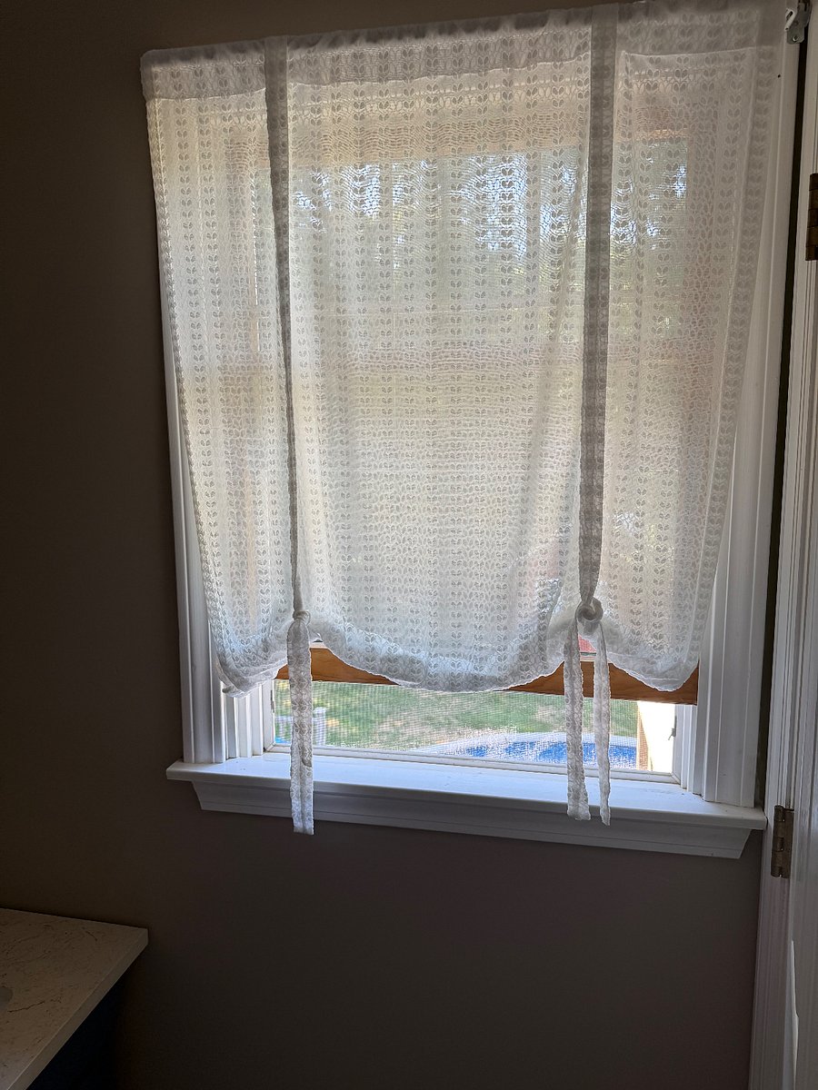 Bathroom window with treatments