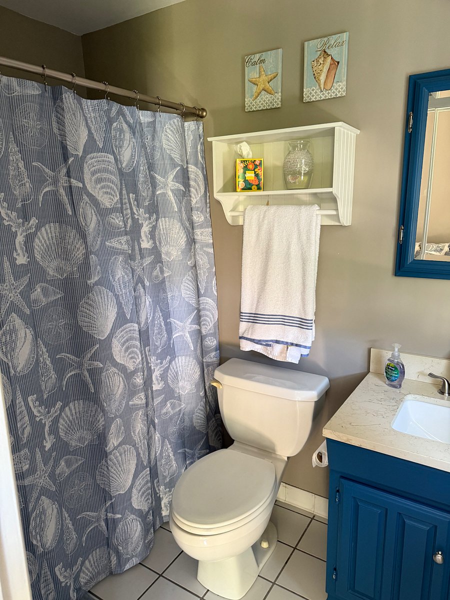 Bathroom either coastal theme and calming colors. Towels and everything to start you boat will be there