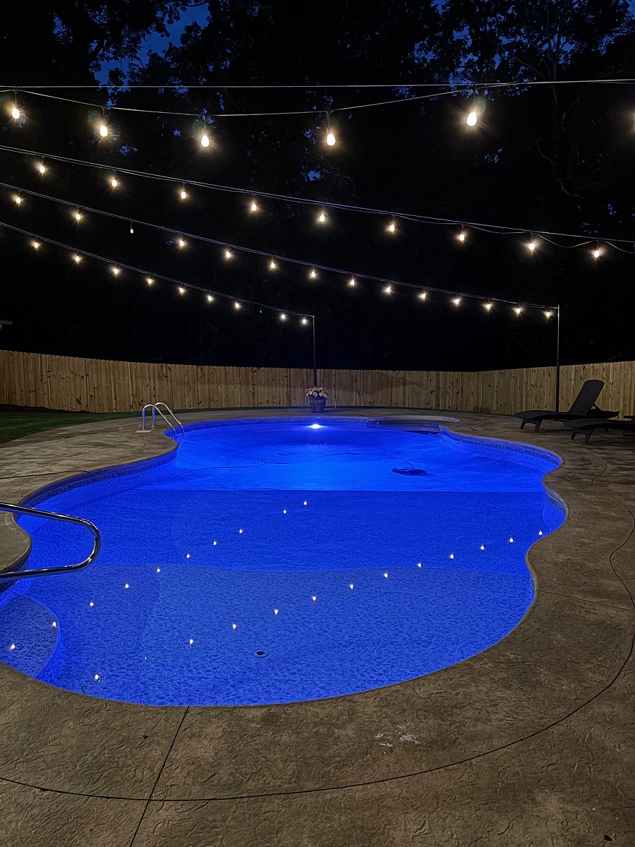 Relaxing pool with overhead cafe lighting to set the mood 