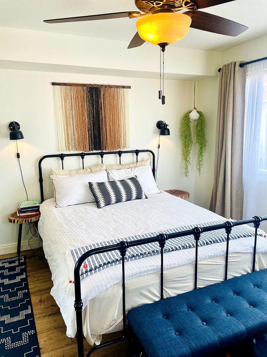Bedroom #1: Queen Sized Bed, blackout curtains, ceiling fan- everything you need for good sleep, regardless of which shift you're on.