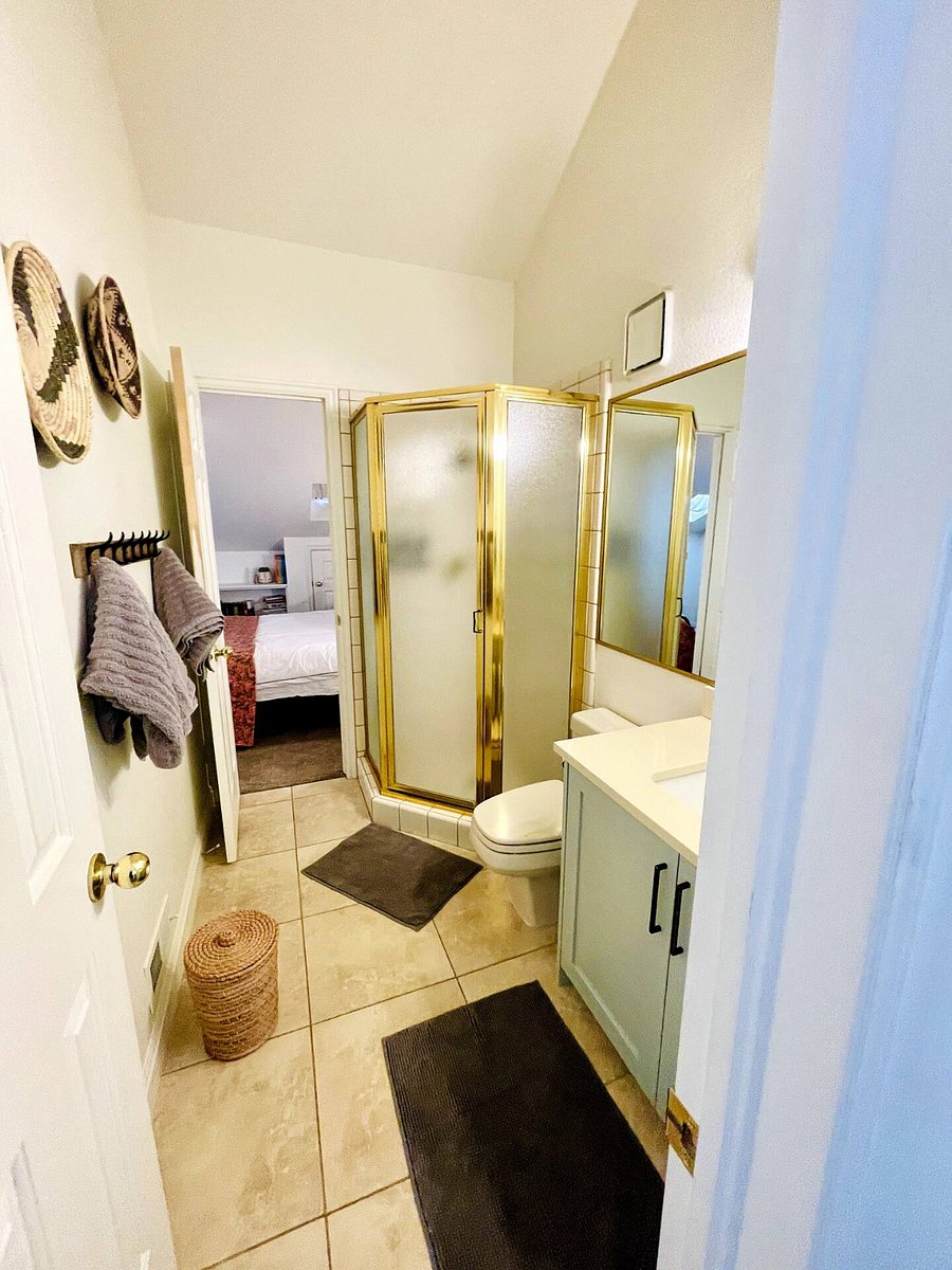 Bathroom #2 located off the upstairs bedroom. Stand up shower; fresh towels provided for a hotel-style touch