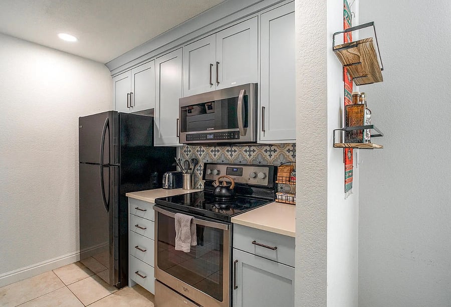Fully equipped kitchen stocked for extended stays, complete with dishware, cookware & seasonings