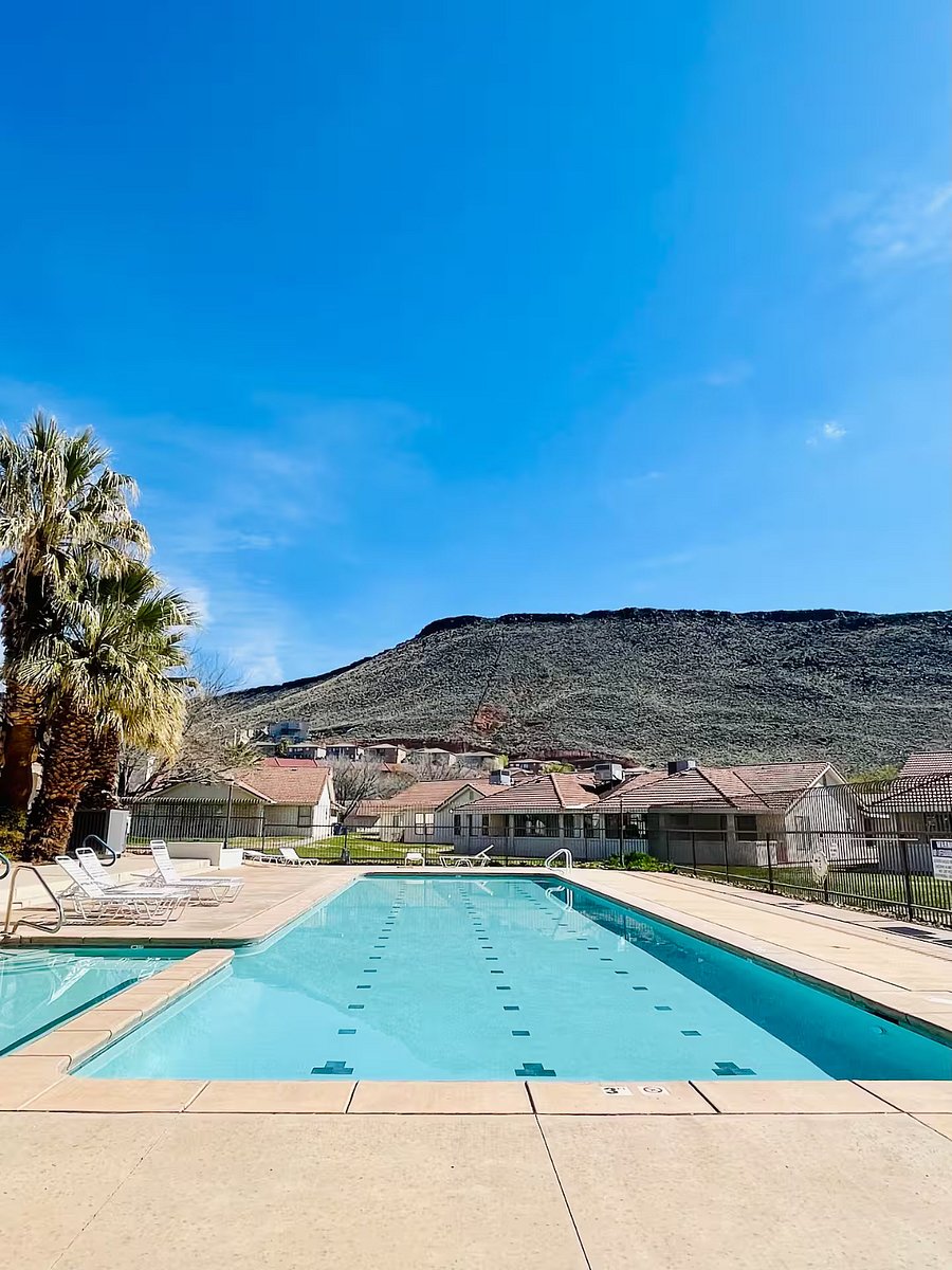 Outdoor swimming pool with plenty of sun and lounge chairs