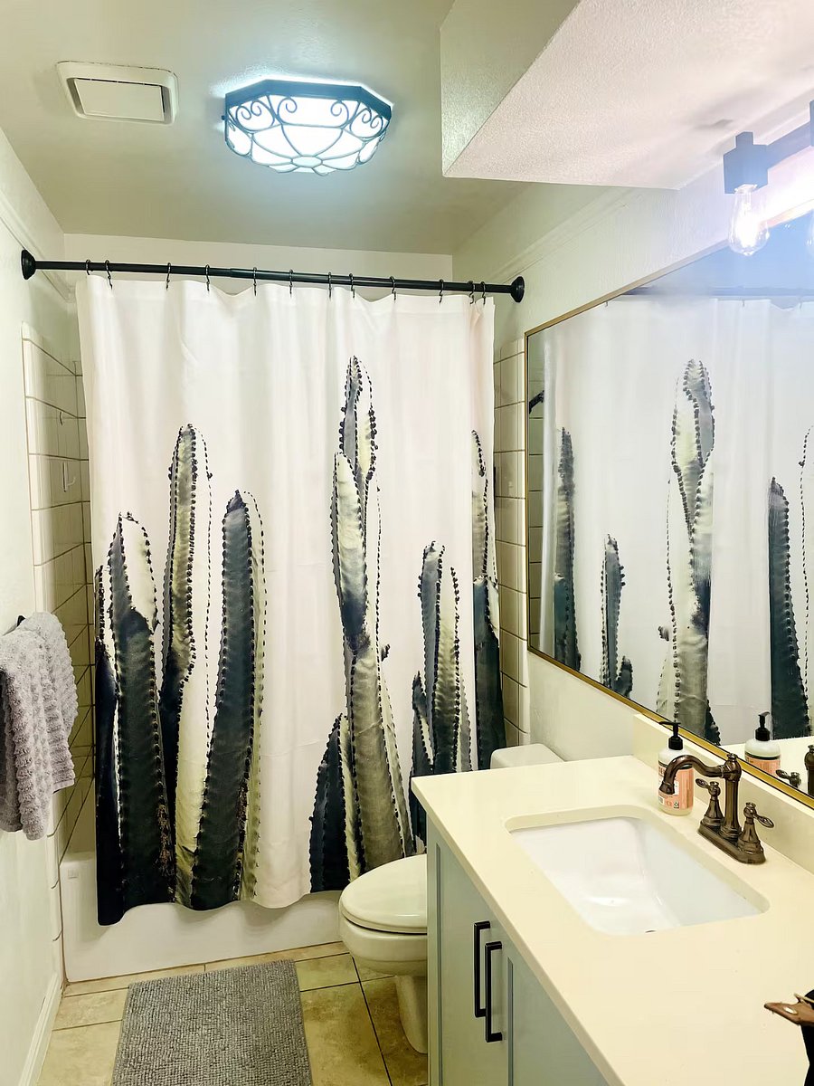 Fresh & functional bathroom with a shower/tub bathroom, located downstairs. A bright, clean space stocked with towels & essentials including all soaps, towels & a blow dryer.
