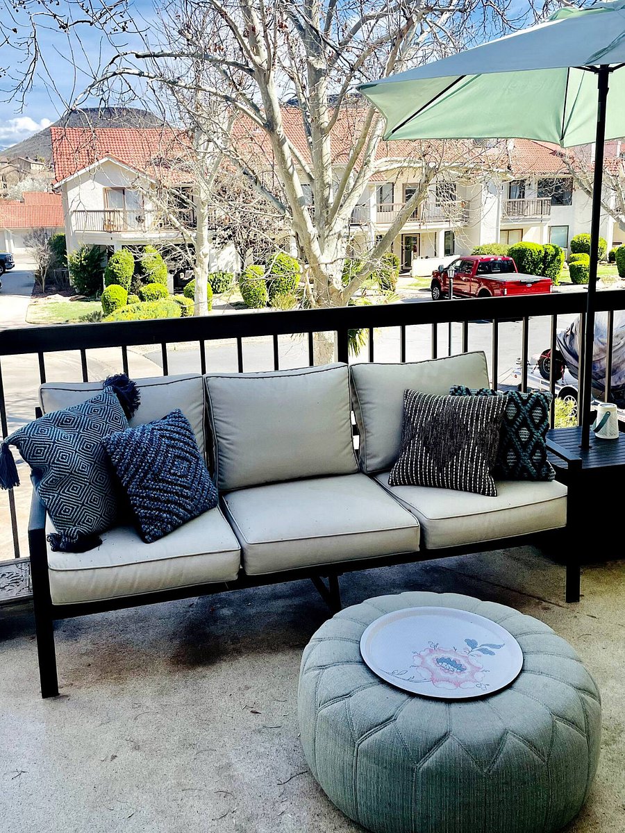 Covered balcony with outdoor seating and dinnmg. Extra perk: the balcony closet is stocked with everything you need: games, pool toys, tennis rackets & more