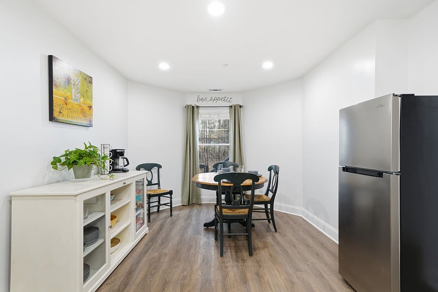 Spacious kitchen with buffet cabinet pantry. Dining table for 4, dishwasher and brand-new oven/stove. Blinds and black out drapes.