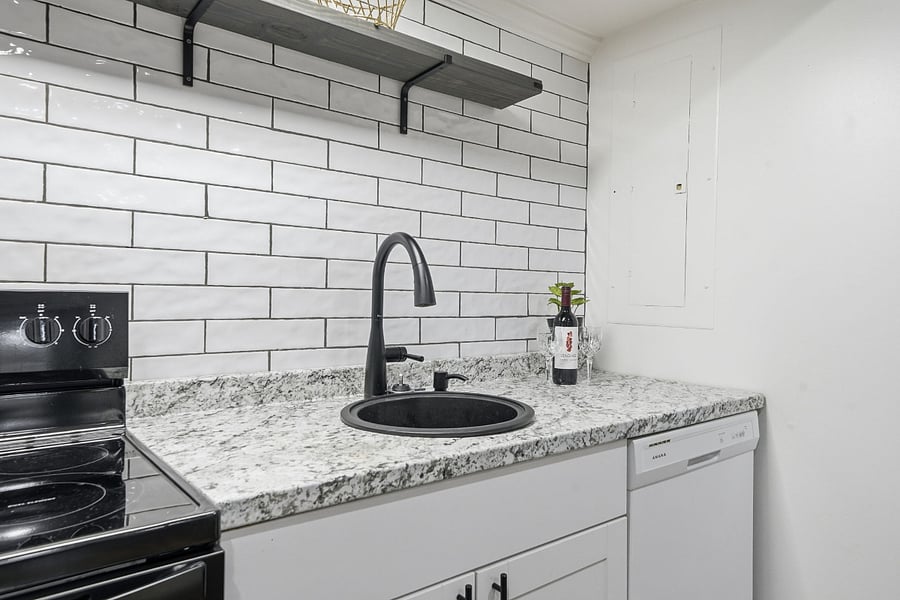 Brand new stove/oven with a full-size dishwasher. Tiled back splash with accent shelf for extra storage. Fully lighted cook surfaces and can lights throughout.