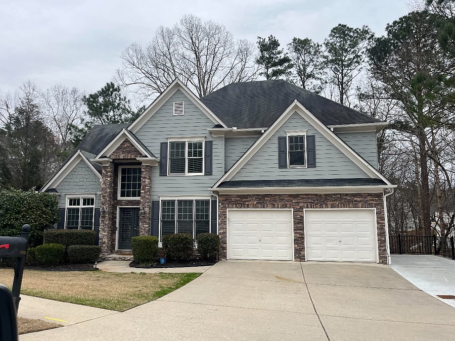 Front of home, the apartment is the complete lower daylight space with windows in the Living, Kitchen and Bedroom. Walk path to apartment is to the right of the new park pad on a well lit.