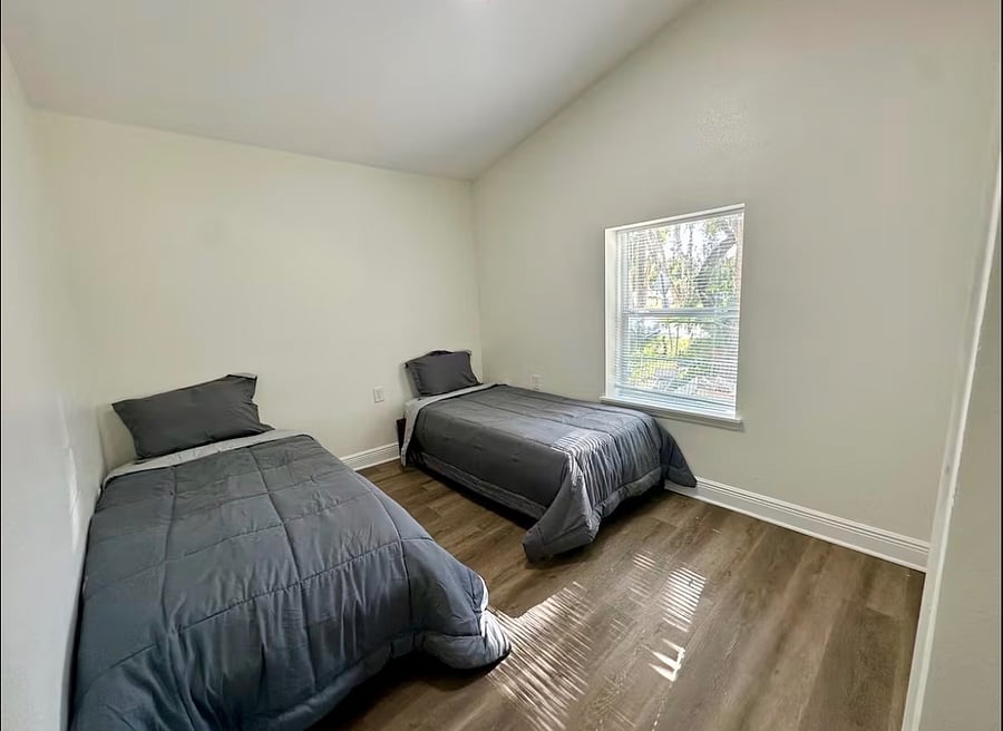 One twin bed and a new bunk bed have been added to this room