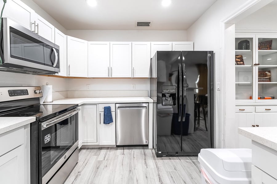 Kitchen including refrigerator, dishwasher, cooktop/oven, and microwave