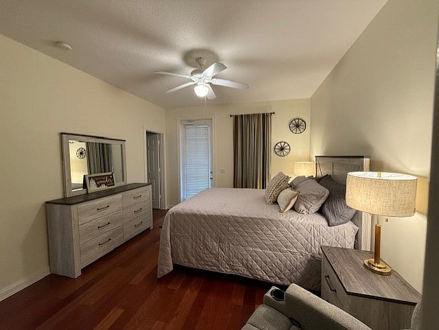 1st Floor Bedroom with a walk in closet, access to the bathroom and a door out to a patio overlooking a pond