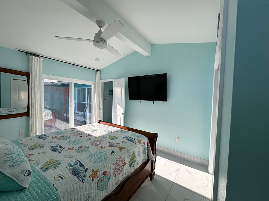 This Bedroom has a siding door to the front garden sitting area