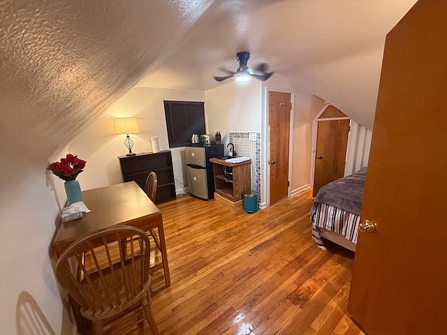 Master bedroom with full private bathroom, attic and dining table/working area