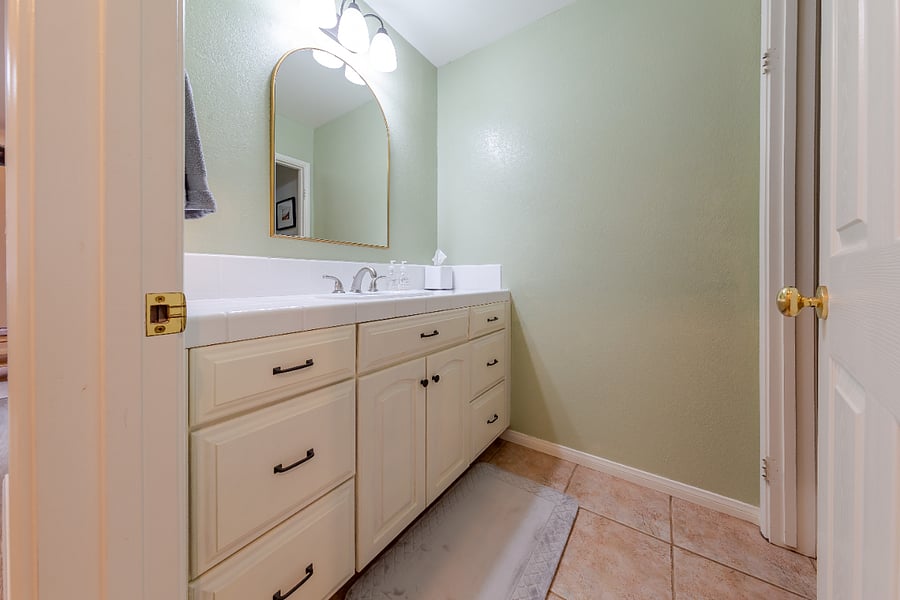Bathroom was updated a few years ago with new paint, mirror and light fixture. One sink.