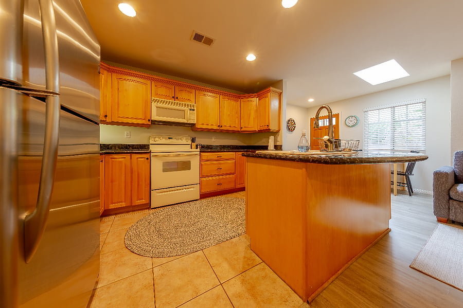 Kitchen has full-size refrigerator, stove/oven, and microwave. Garbage disposal just replaced recently. Culligan water filter at sink for fresh/filtered drinking water.