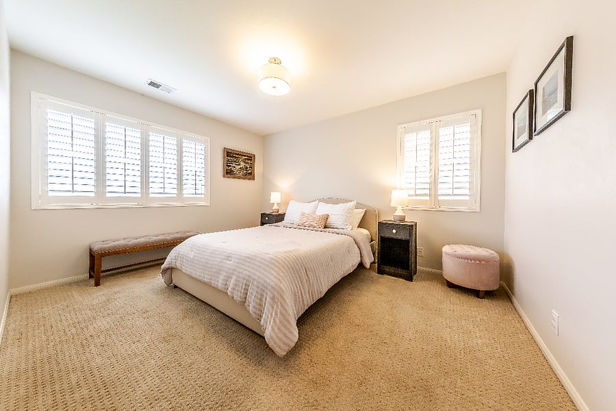 Another angle of bedroom, nice wooden plantation shutters in both rooms.