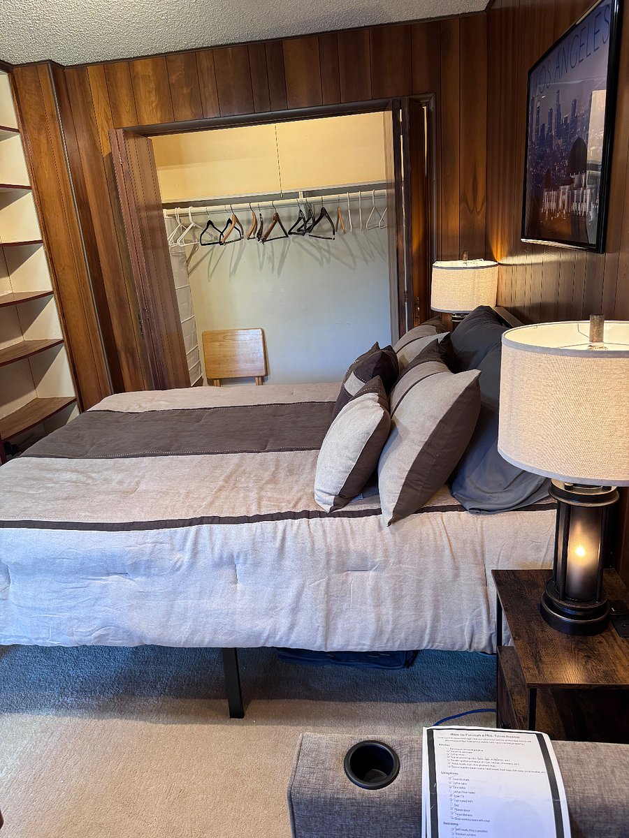 8' long hidden closet. 7 tiered storage shelves
