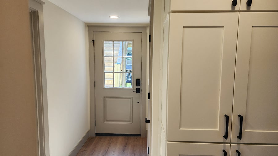Downstairs/Addition Hallway Pantry & Exit to Deck