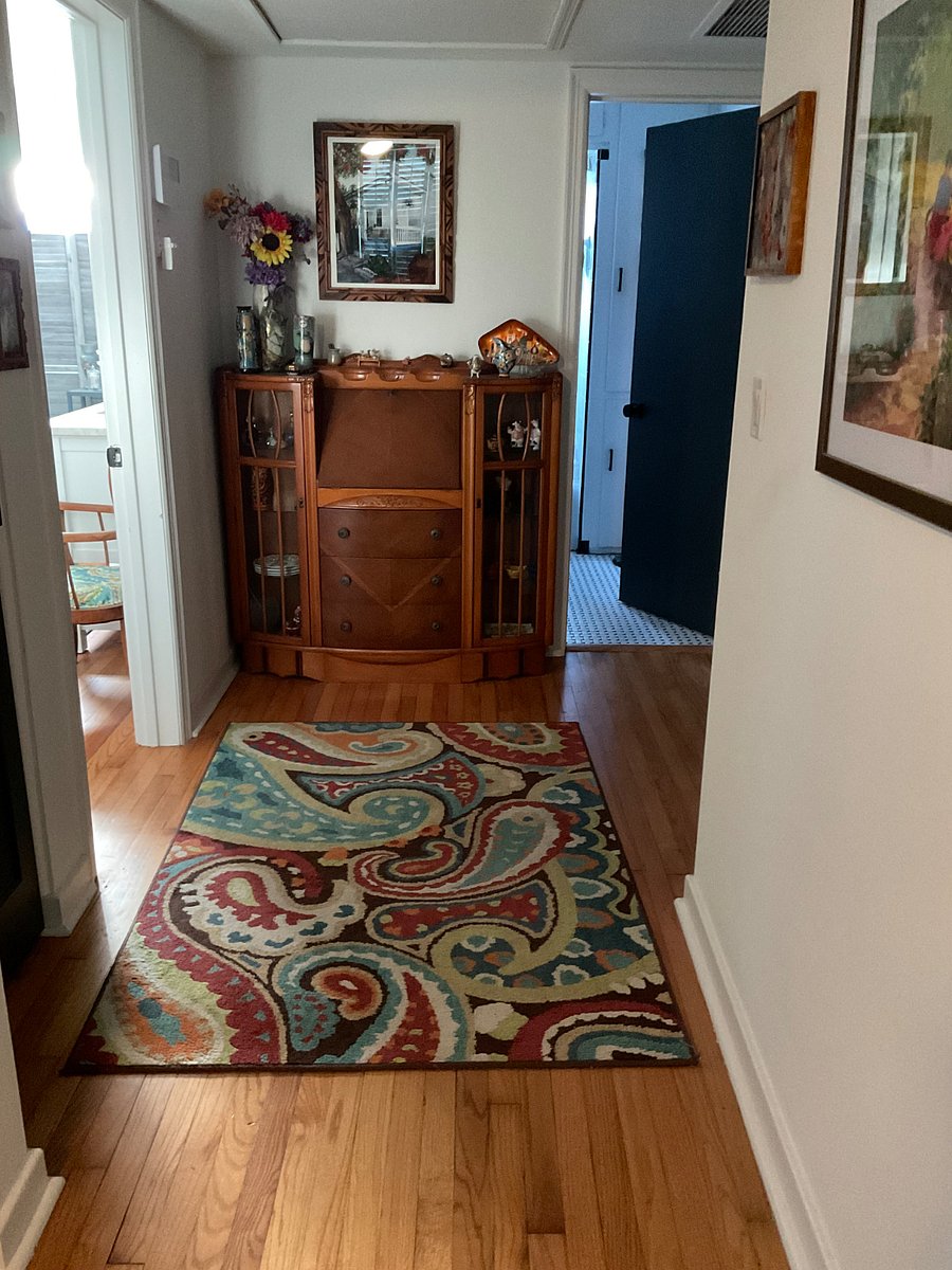 Hallway to bedroom/office and private bathroom.