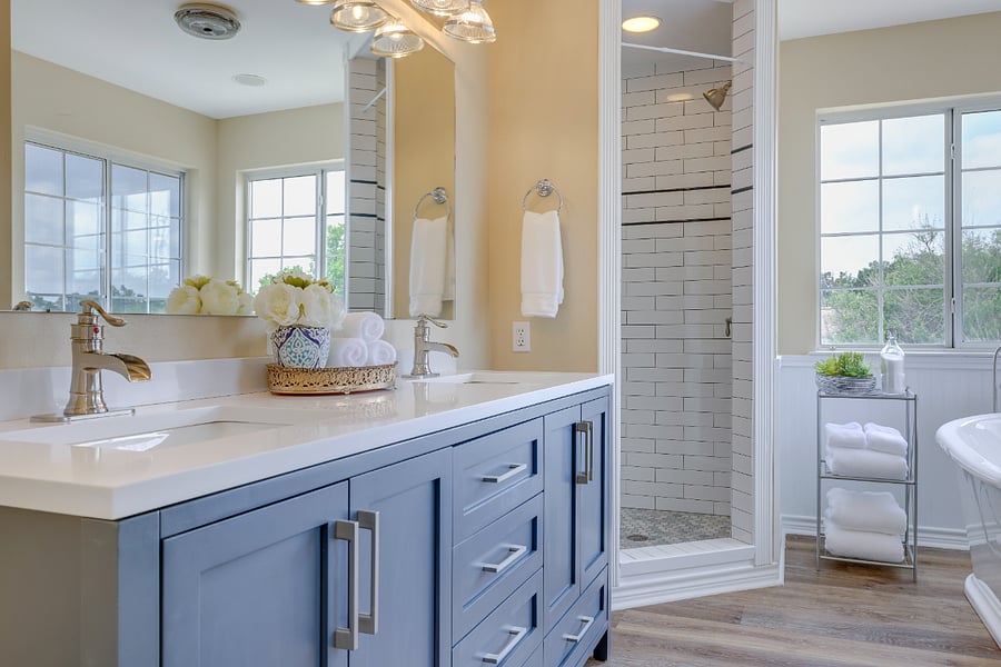 Primary bathroom has been completely renovated with new vanity, subway tile shower, and free-standing tub