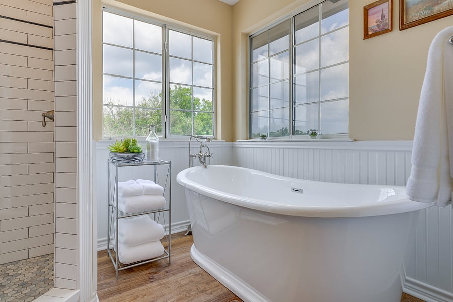 Primary bathroom has a free-standing double slipper tub