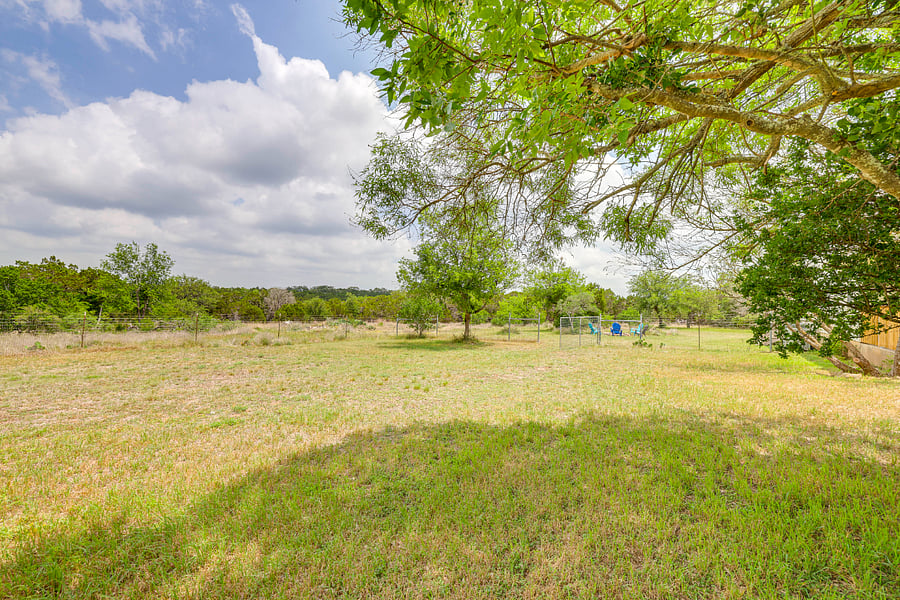 Large enclosed dog yard with back porch