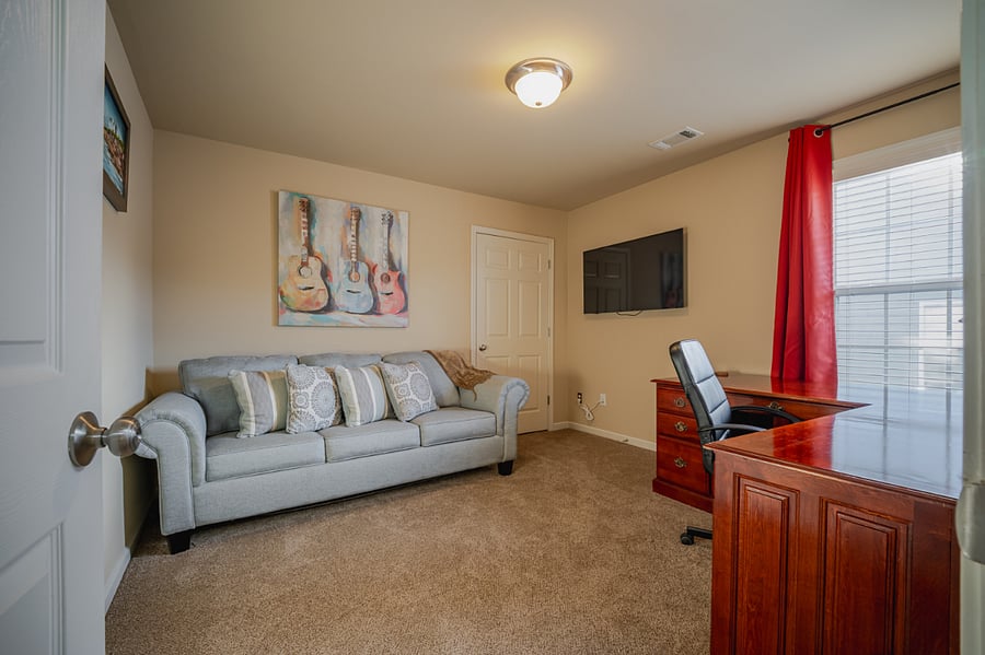 Bedroom 5/office with L-shaped desk and queen size sleeper sofa