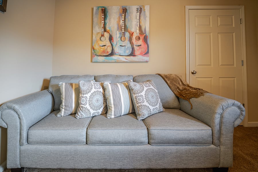 Bedroom 5/office with L-shaped desk and queen size sleeper sofa