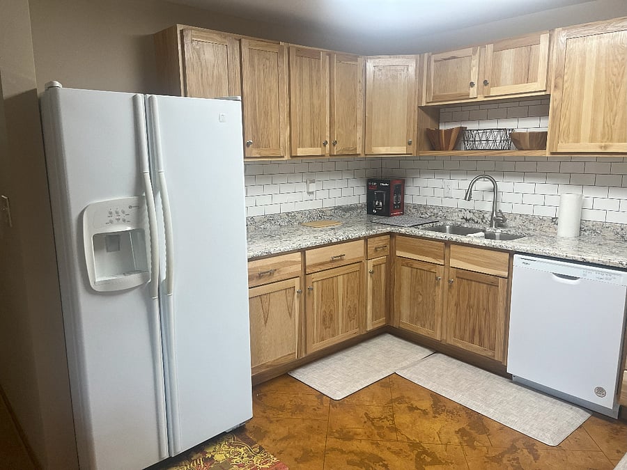 Well stocked kitchen with new full size appliances and granite countertops and solid wood cabinets.