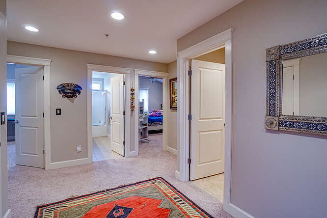 Upstairs flex room is large with linen storage