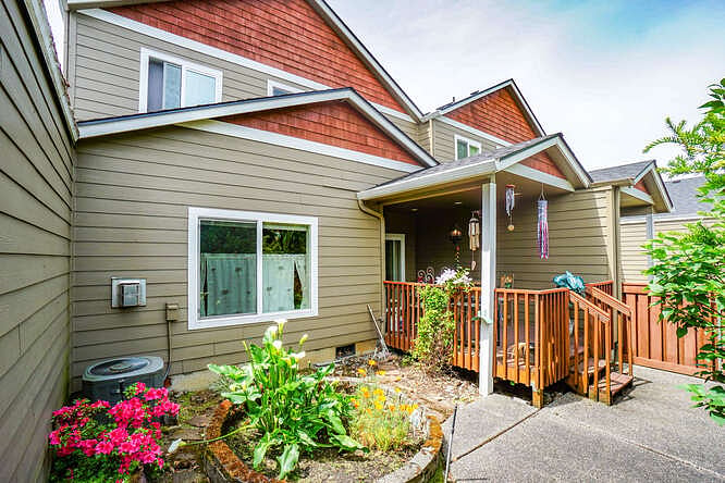 Rear yard is private, colorful and completely fenced.