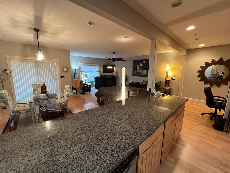 Generously sized granite slab countertops for several chefs in the kitchen