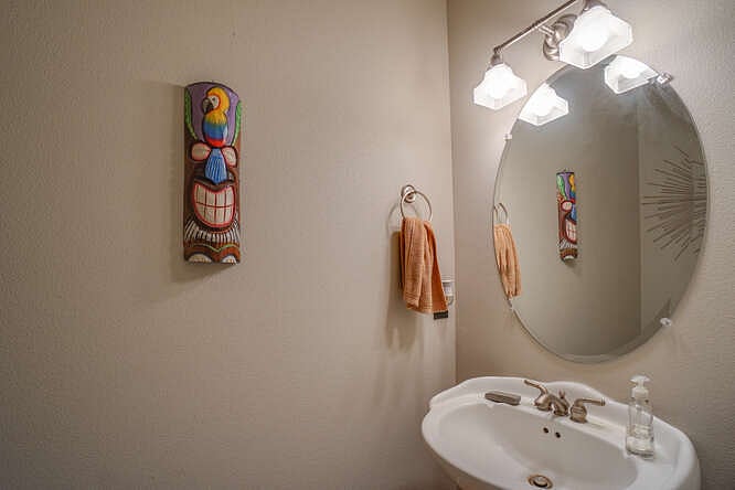 Powder room off downstairs entry. 