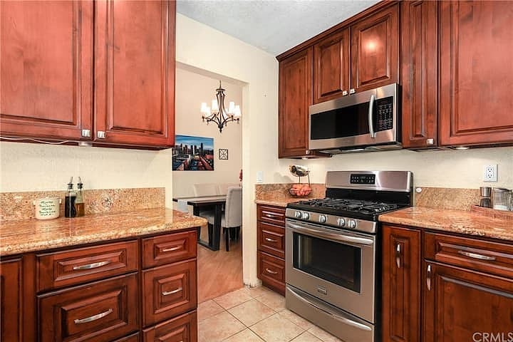 The full kitchen connects to the dining room and provides plenty of space to cook.