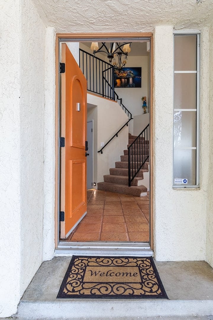 Front door opens into a lofted and spacious entrance space.