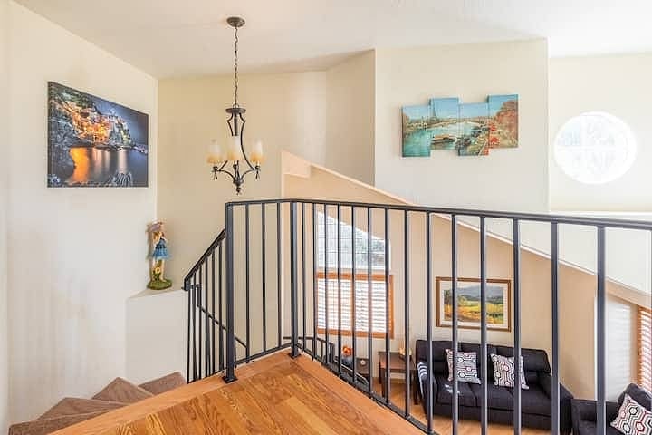 The wraparound stairwell leads you to the two bedrooms sharing a bathroom as well as the private and spacious primary suite.