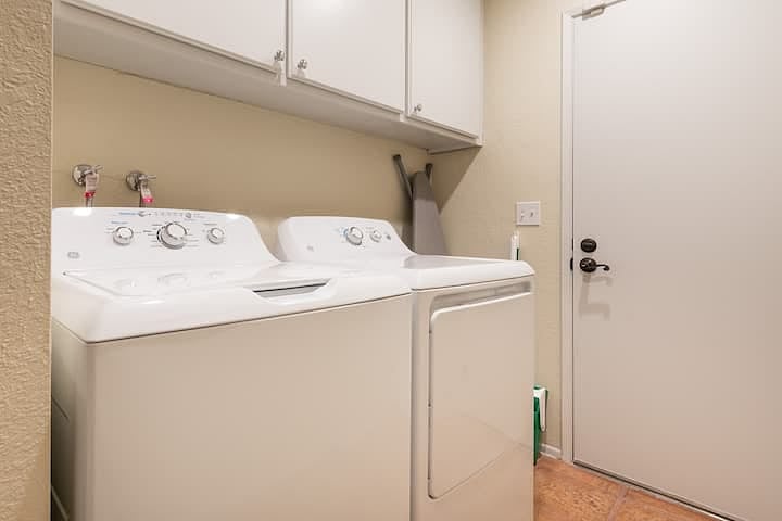 A laundry room connects between the first floor and the garage space.