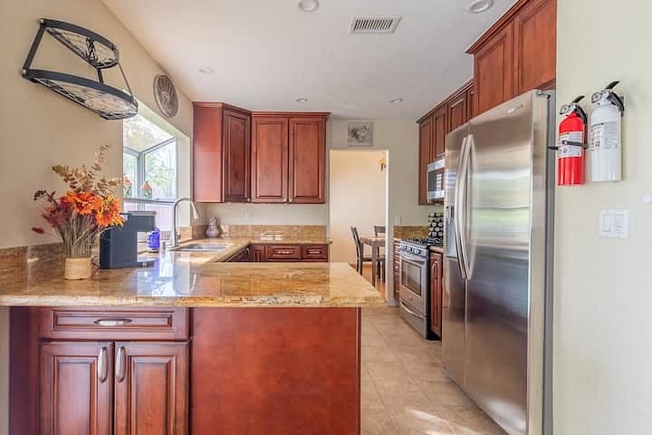 The kitchen has a dining peninsula which connects into the entertainment space.